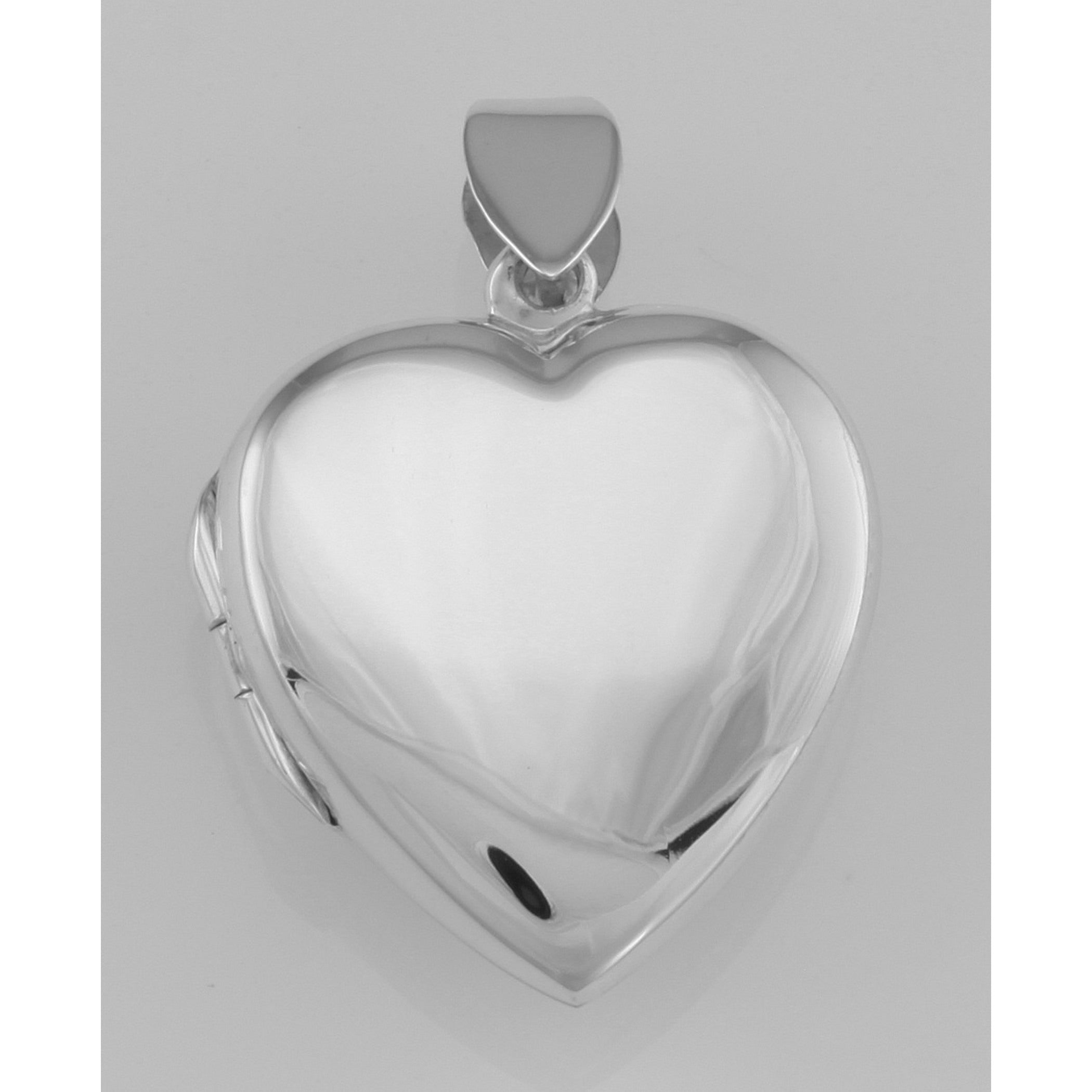 Detail view of Vintage Style Double Heart Locket Pendant in Fine Sterling Silver highlighting design details
