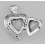 Detail view of Vintage Style Double Heart Locket Pendant in Fine Sterling Silver highlighting design details