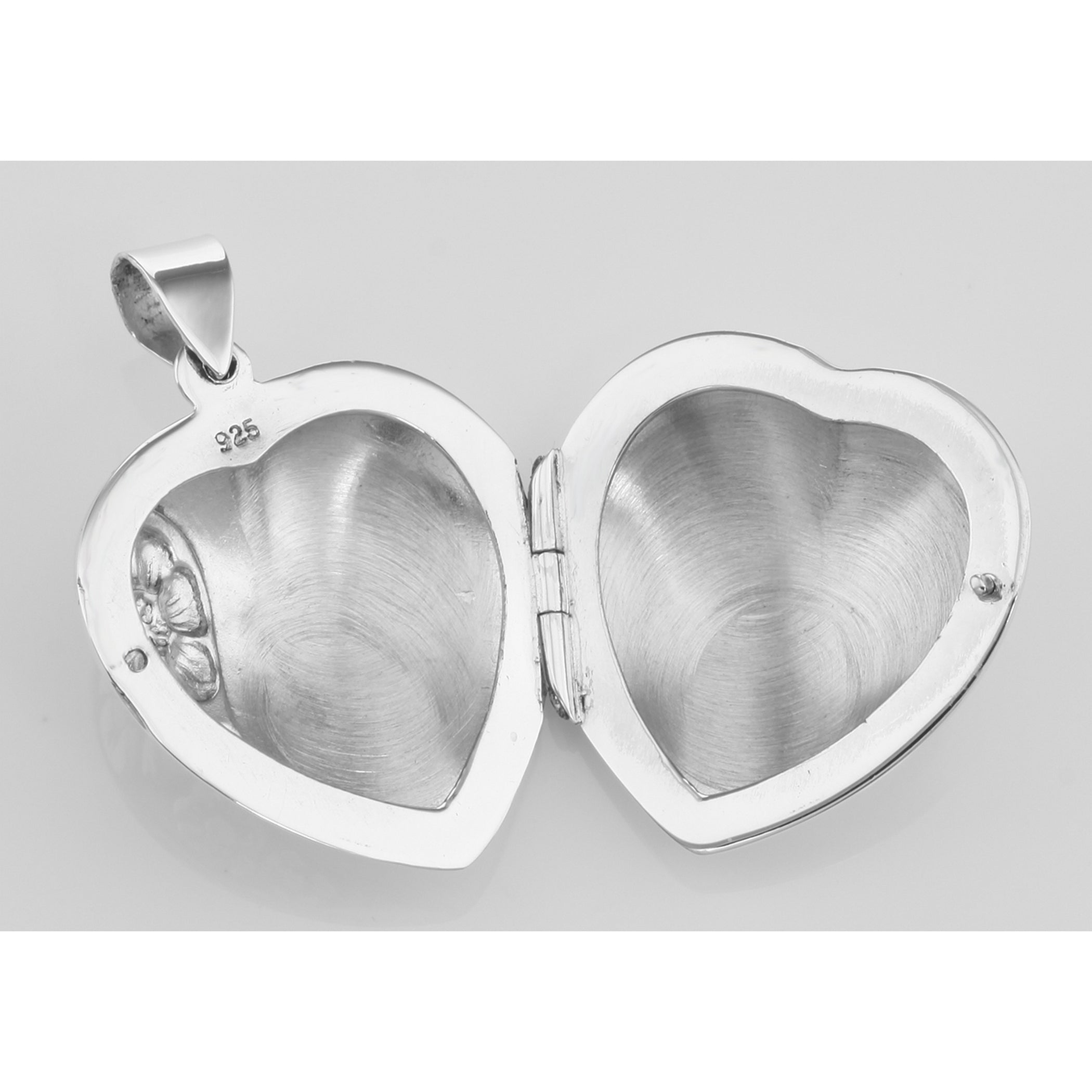 Detail view of Antique Style Puffy Heart Locket Pendant - Flower Design highlighting design details