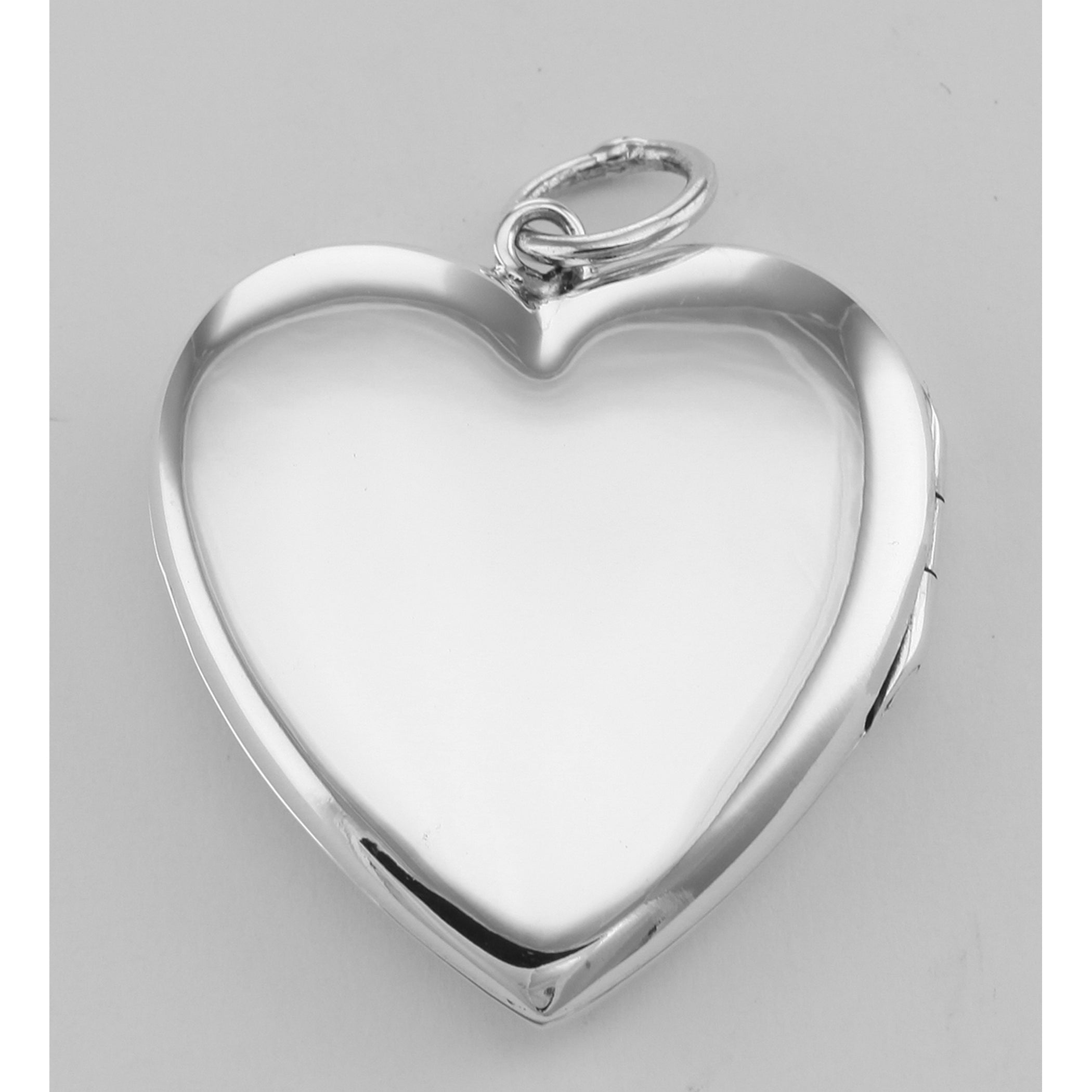 Detail view of Cherub Heart Sterling Silver Locket Pendant with Blue CZ's highlighting CZ