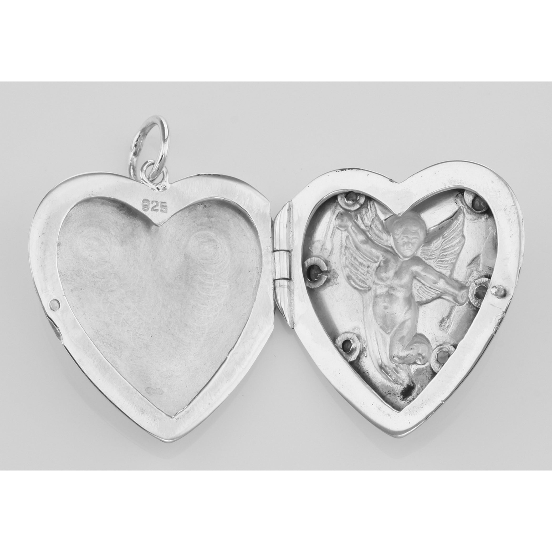 Detail view of Cherub Heart Locket Pendant Red CZ's highlighting CZ