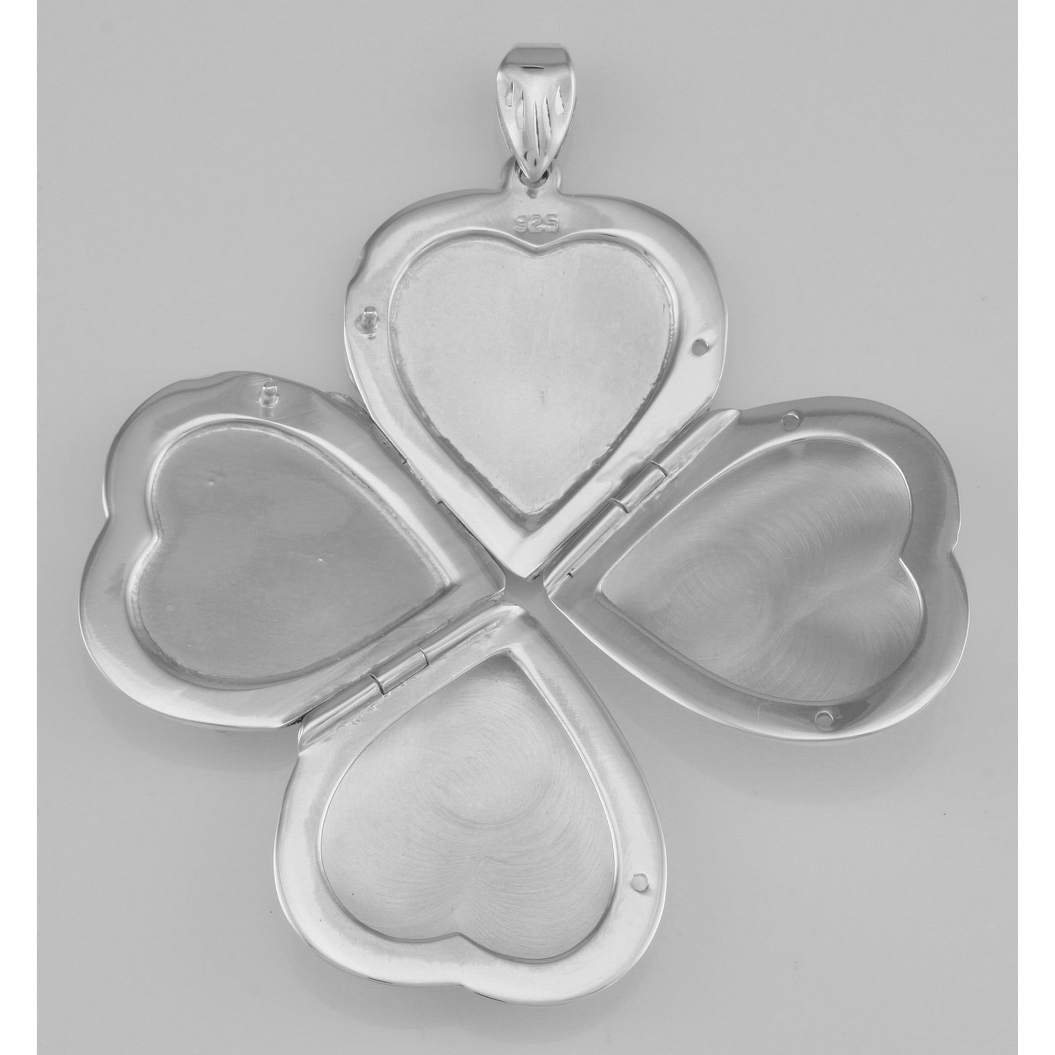 Detail view of Beautiful Sterling Silver Heart Locket Pendant - 4 Photo Large Clover highlighting design details