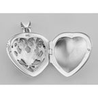 Back view of Antique Style Scroll Design Filigree Heart Locket - Solid Back showing 925 sterling silver hallmark and spring r
