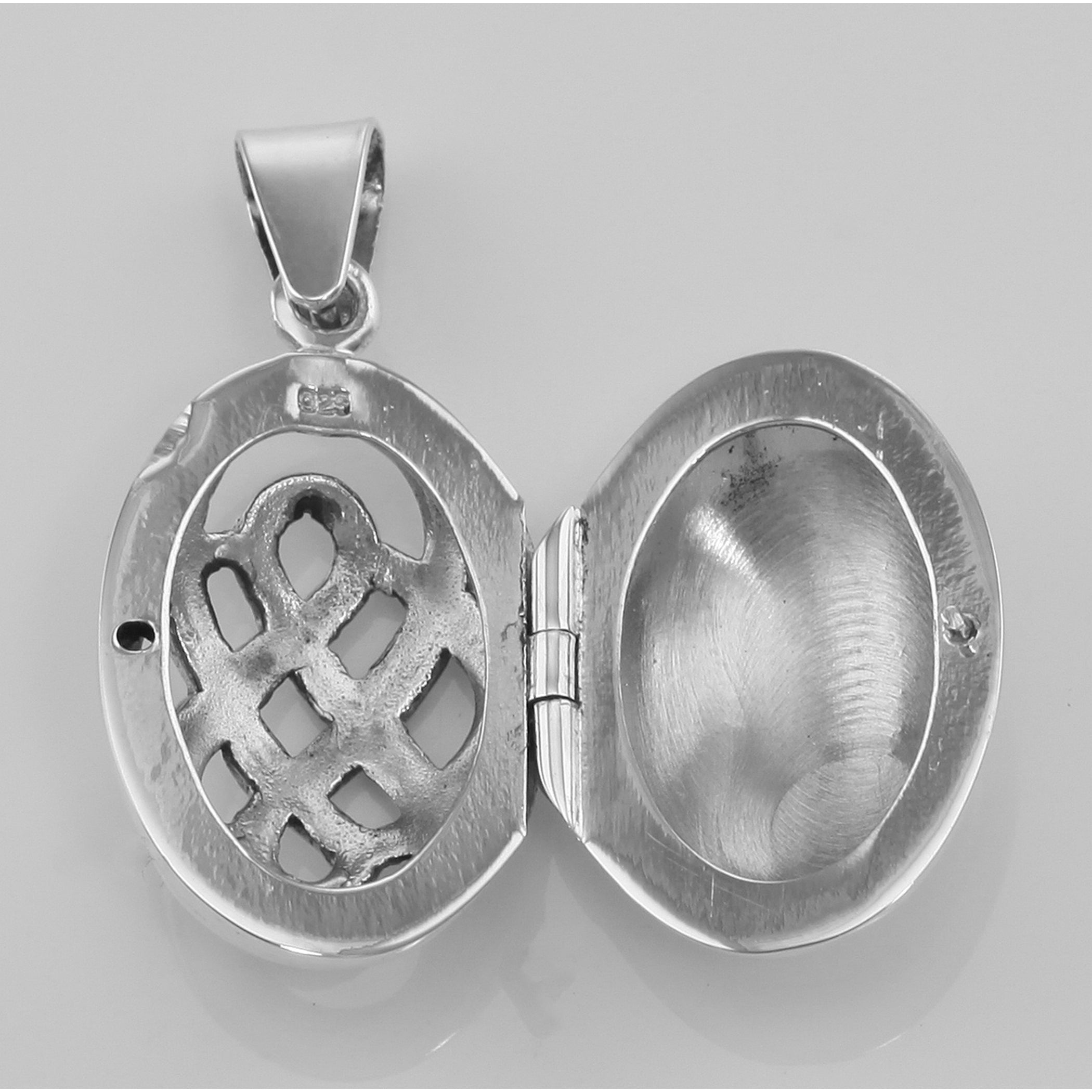 Back view of Classic Celtic Knot Design Sterling Silver Oval Filigree Locket showing 925 sterling silver hallmark and spring 