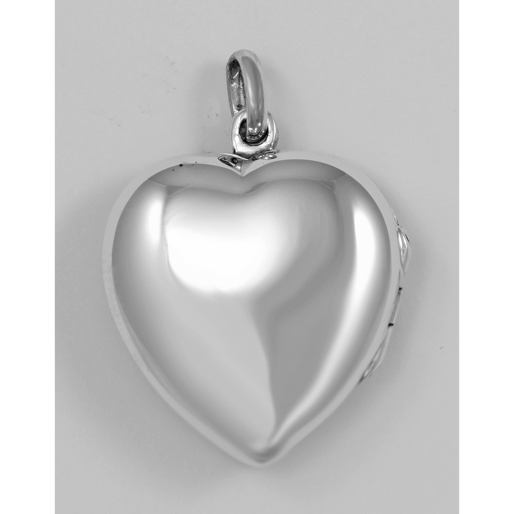 Detail view of Large Filigree Rose Heart Locket highlighting design details