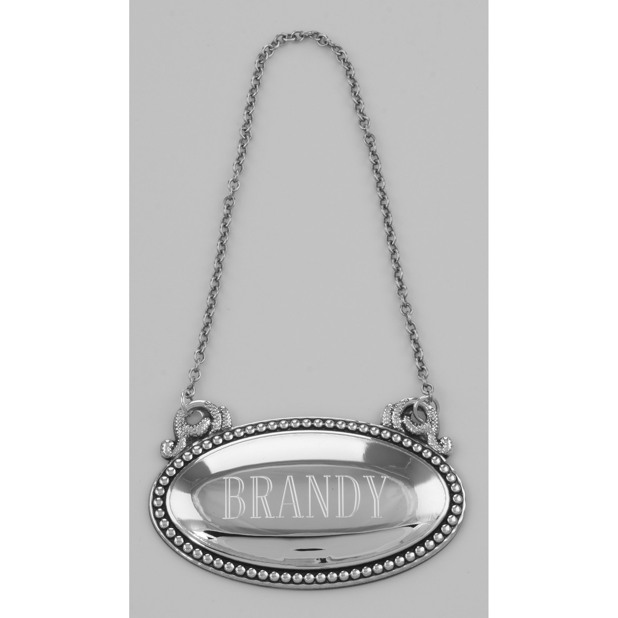 Detail view of Brandy Liquor Decanter Label / Tag - Oval beaded Border - Made in USA highlighting design details