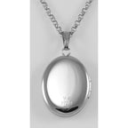 Detail view of Sterling Oval Locket with 14kt Gold Cross - Made in USA highlighting design details