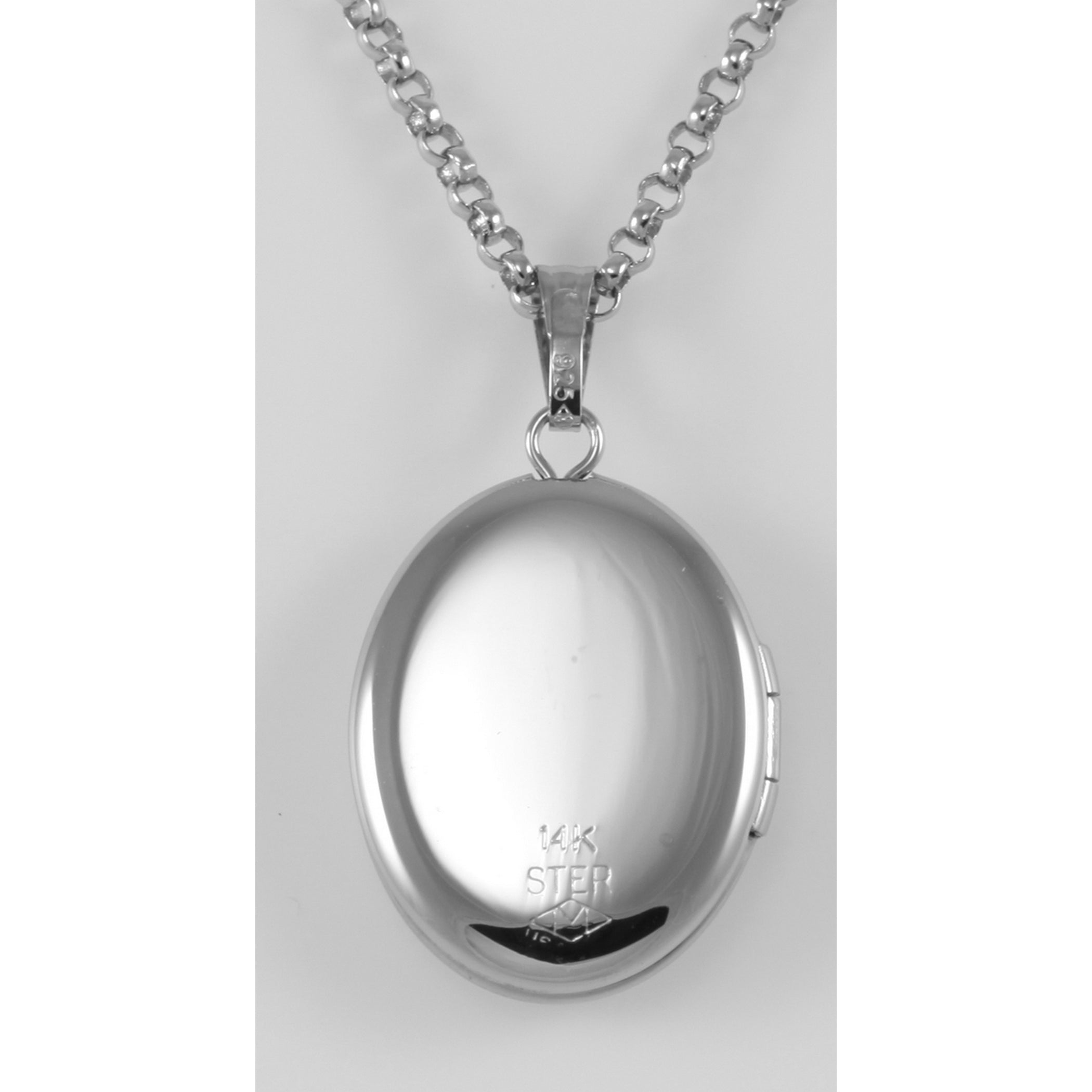Detail view of Sterling Oval Locket with 14kt Gold Cross - Made in USA highlighting design details