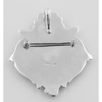 Detail view of Art Nouveau Style Cherub Pin or Pendant highlighting design details