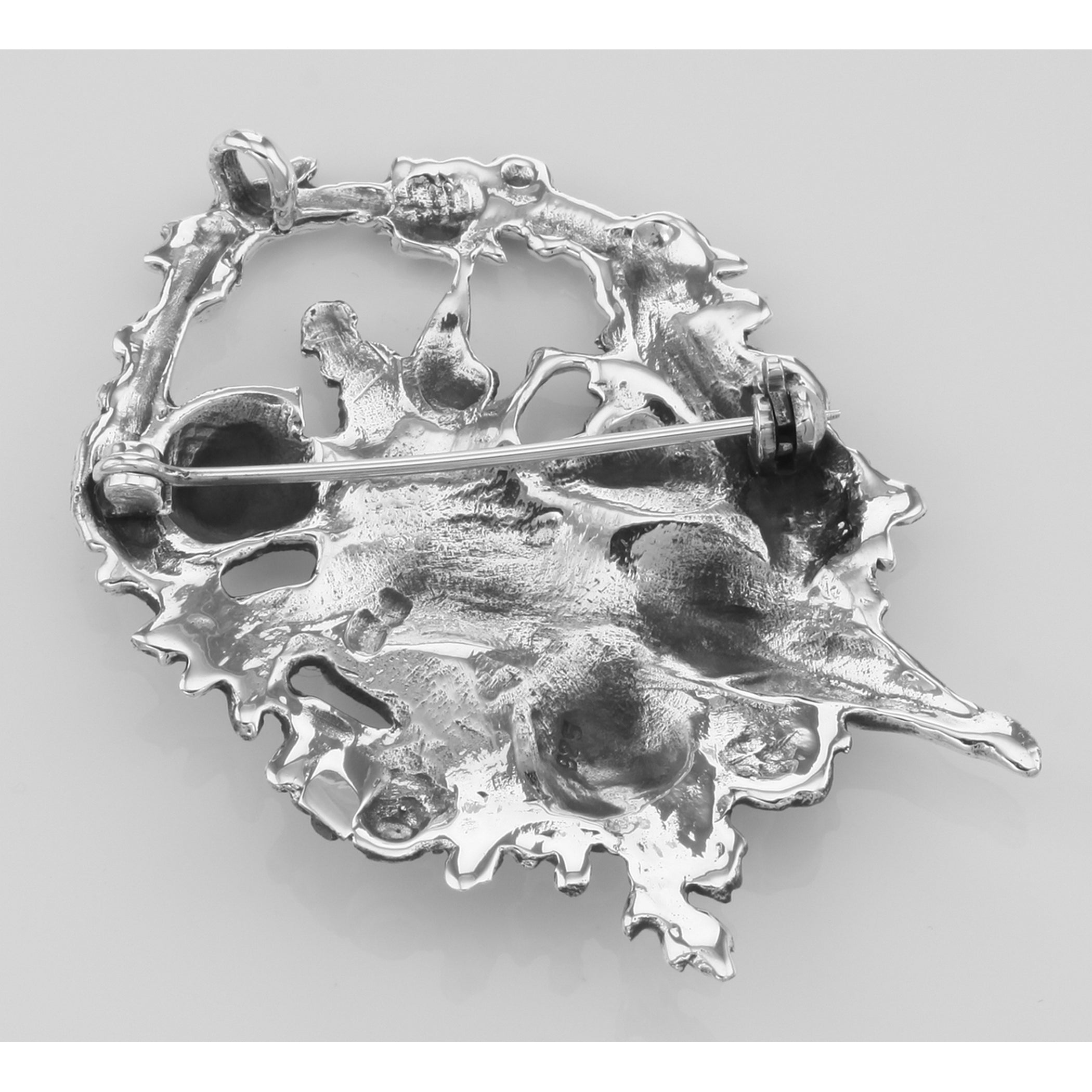 Back view of Cupid / Cherub Pin or Brooch or Pendant showing 925 sterling silver hallmark and spring ring clasp
