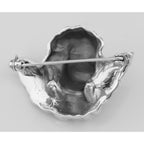Back view of Winged Cherub Head Pin or Brooch showing 925 sterling silver hallmark and pin back