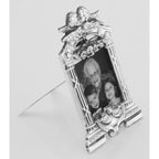 Detail view of Victorian Style Cherubs Mini Picture Frame in Fine Sterling Silver highlighting design details