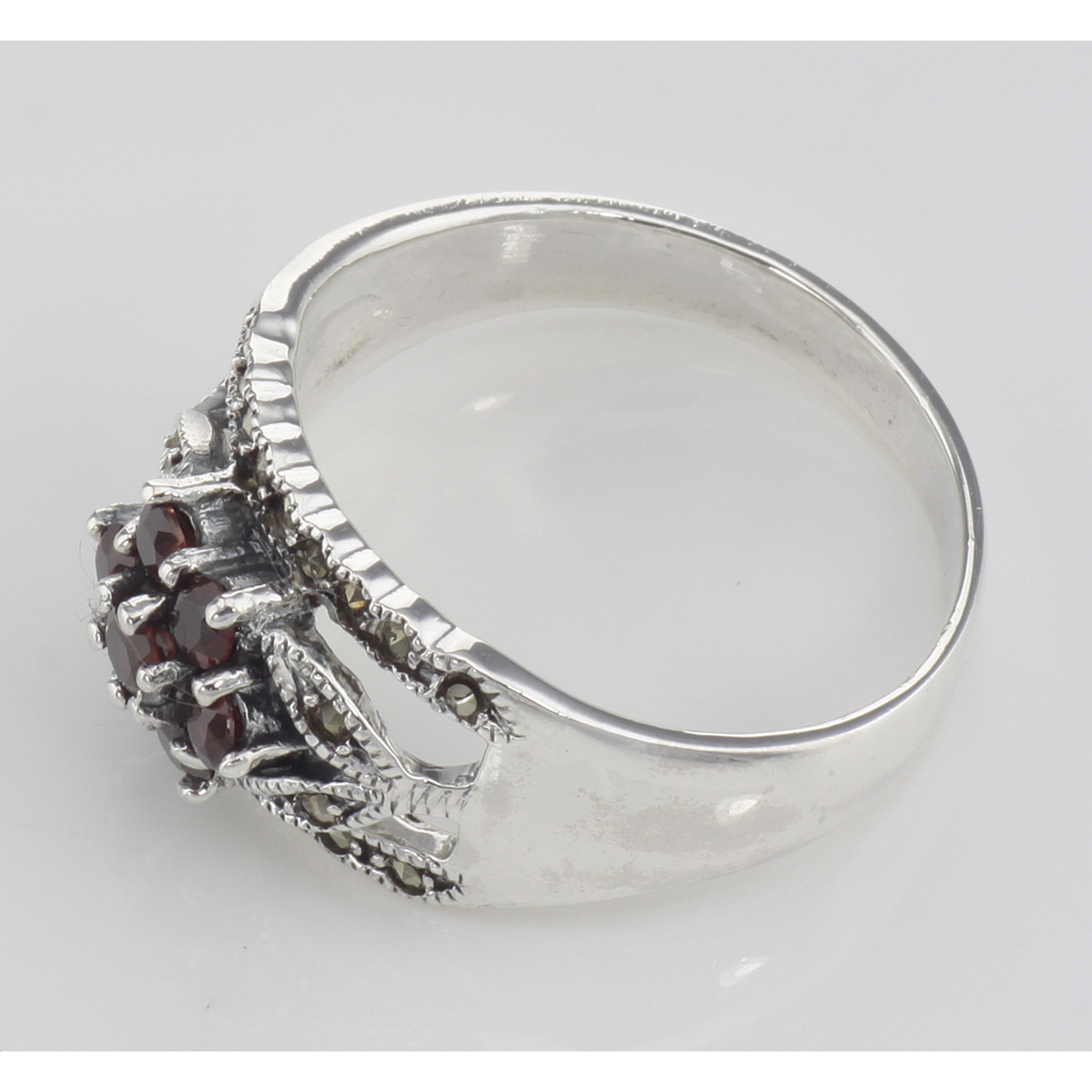 Detail view of Floral Design Red Garnet Ring with Marcasite accents highlighting Garnet, Marcasite