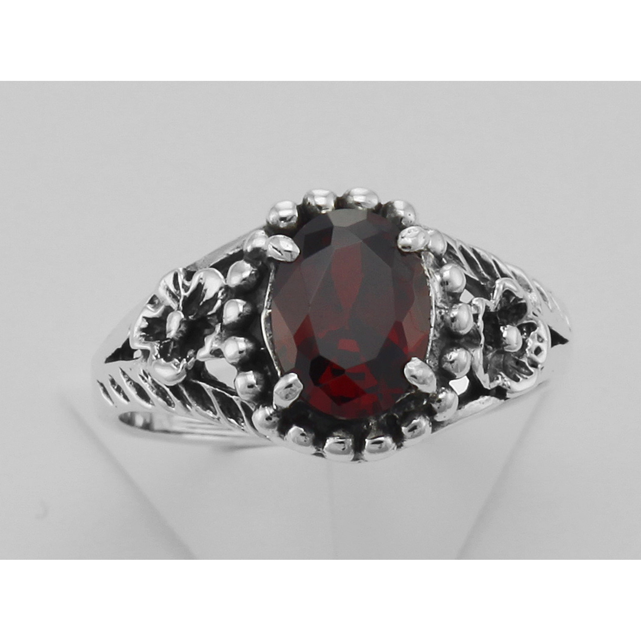 Detail view of Synthetic Garnet Ring highlighting Garnet