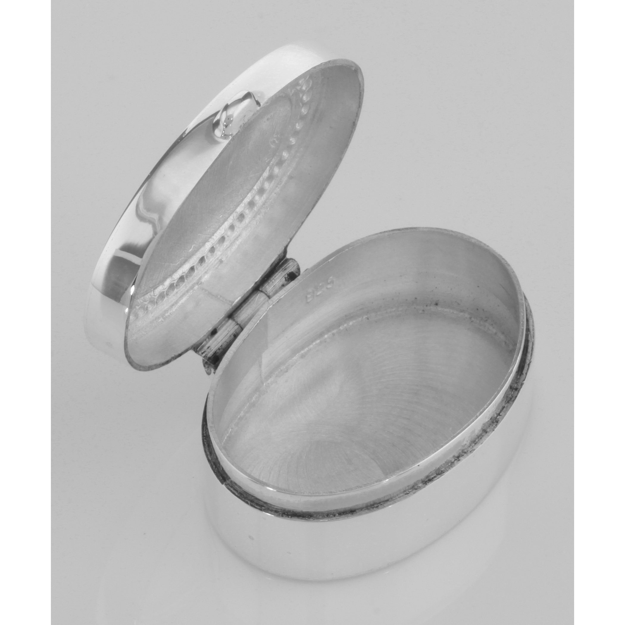 Detail view of Small Oval Beaded Border Keepsake Sterling Silver Pillbox - Engravable highlighting design details