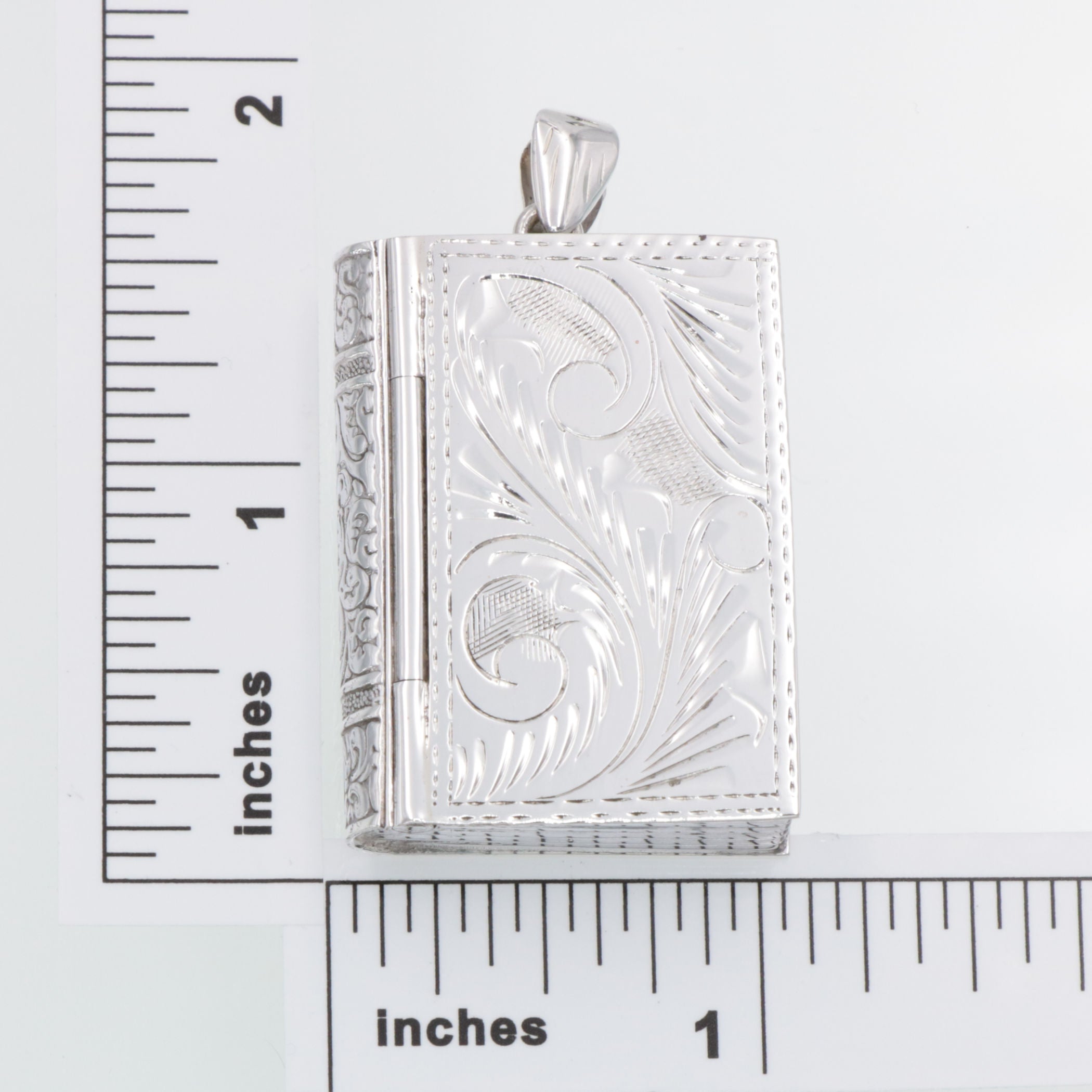 Detail view of Book Pillbox - Etched highlighting design details